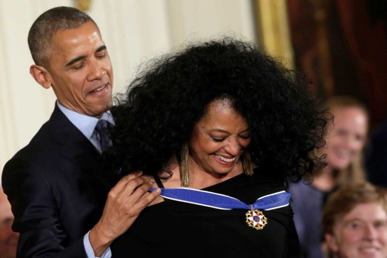Diane Ross receives her medal from Obama